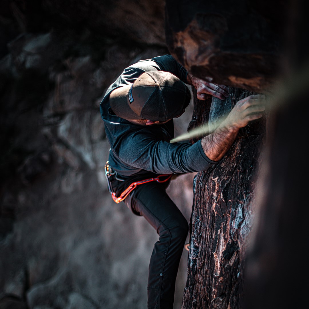 Photograph of one person climbing the mountain